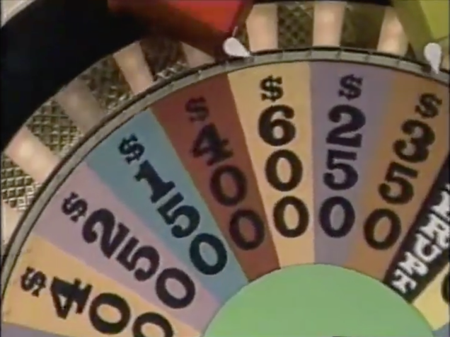By laying the wheel flat and shooting it from above, art director Ed Flesh opened up the Wheel Of Fortune set’s sight lines for the cameras positioned on the floor.